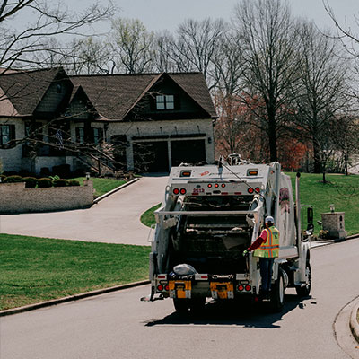 Stinky Pinky residential garbage truck in neighborhood